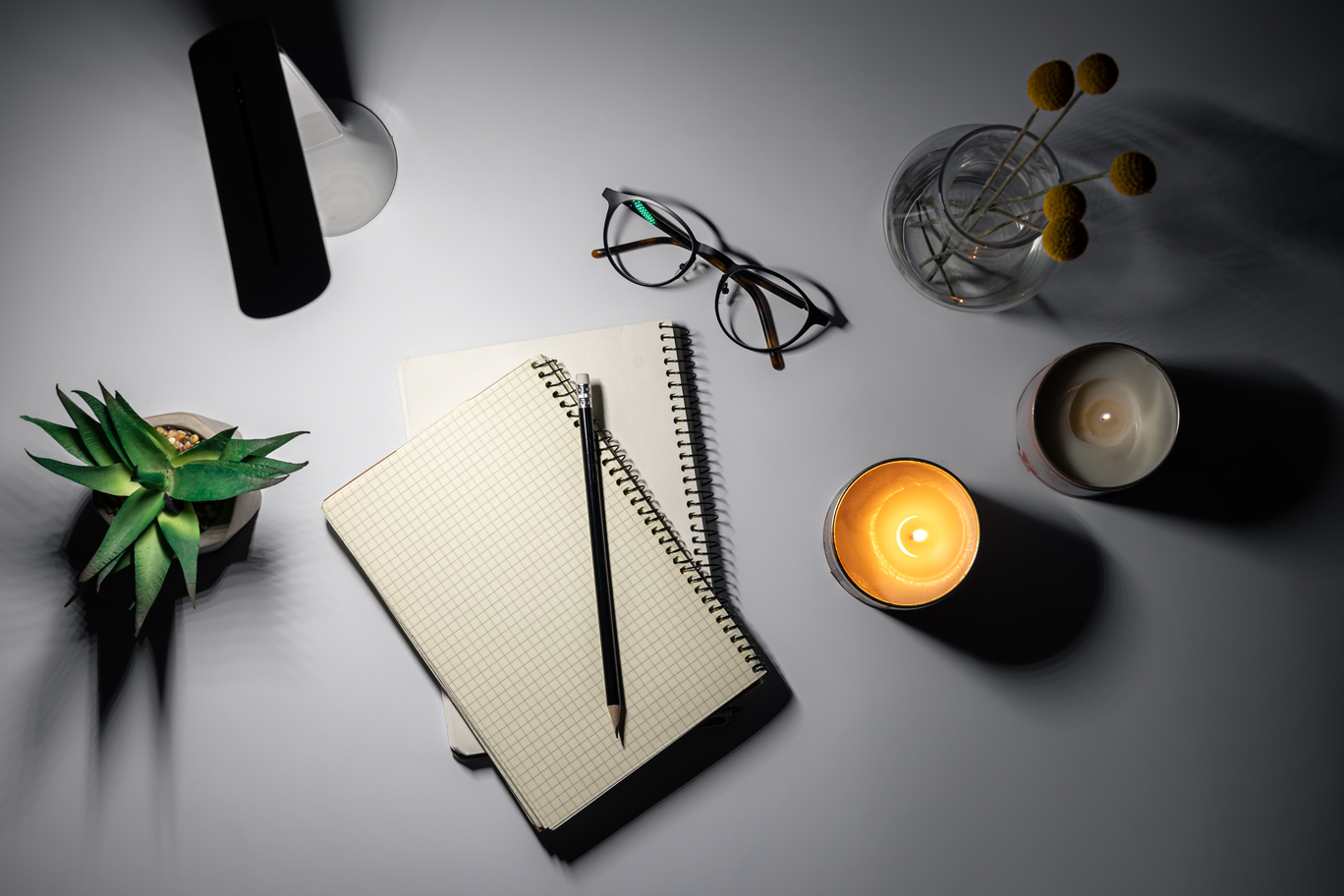 flat-lay-notepad-lamp-workplace-night people working on restaurant project design