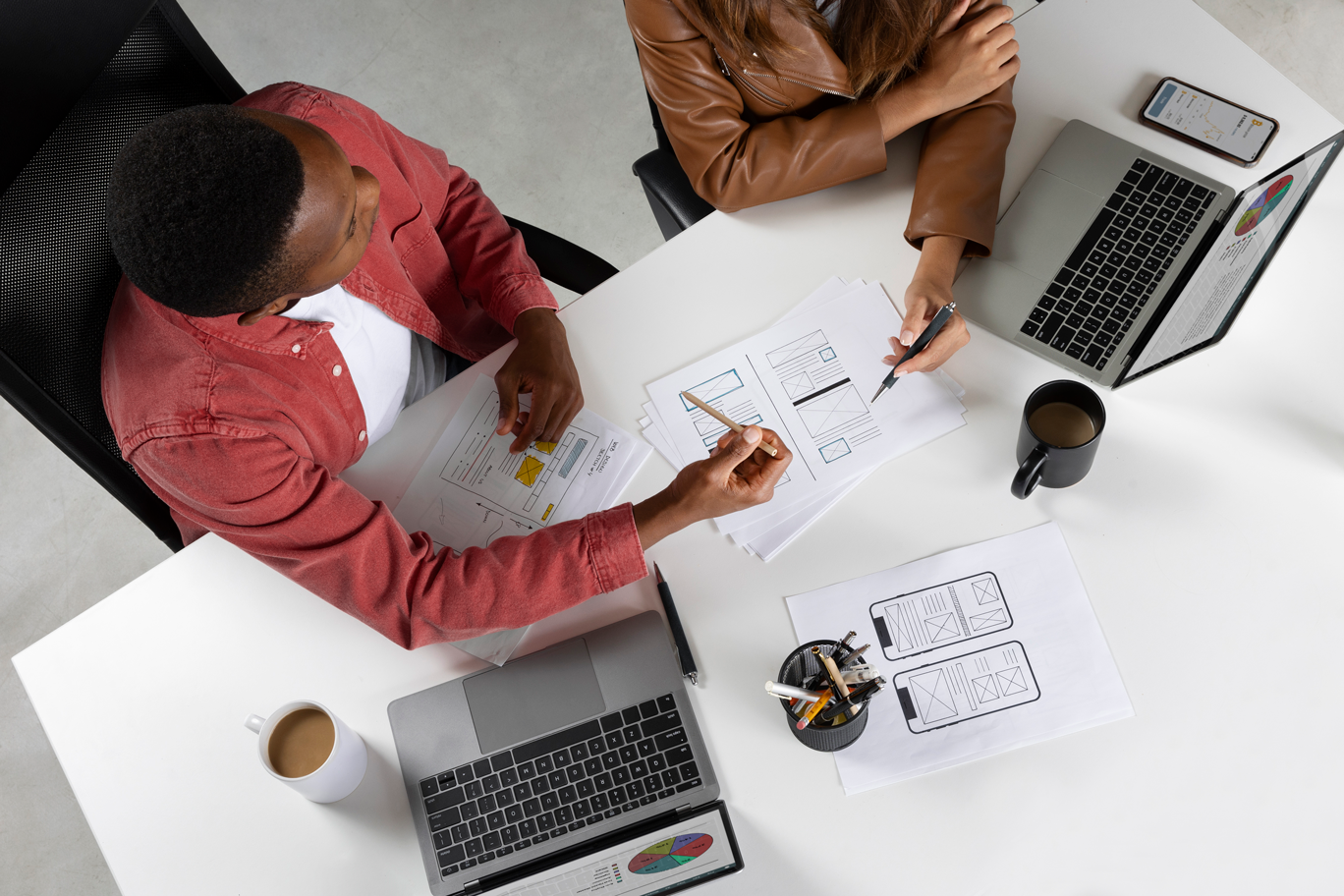 top-view-people-working-with-laptops people working on restaurant project management
